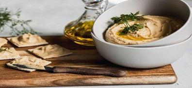 FUN Sesames Tahini Spread | Nutty and rich sesame paste in a bowl, perfect for adding depth and flavor to your favorite dishes.
