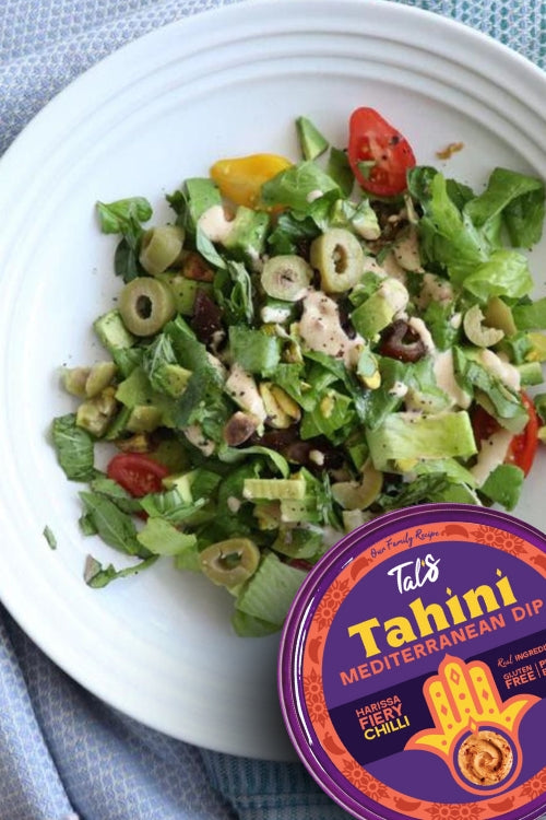 Fall Flavor Salad on a plate with Tal's Tahini Mediterranean Dip Harissa Fiery Chilli featured