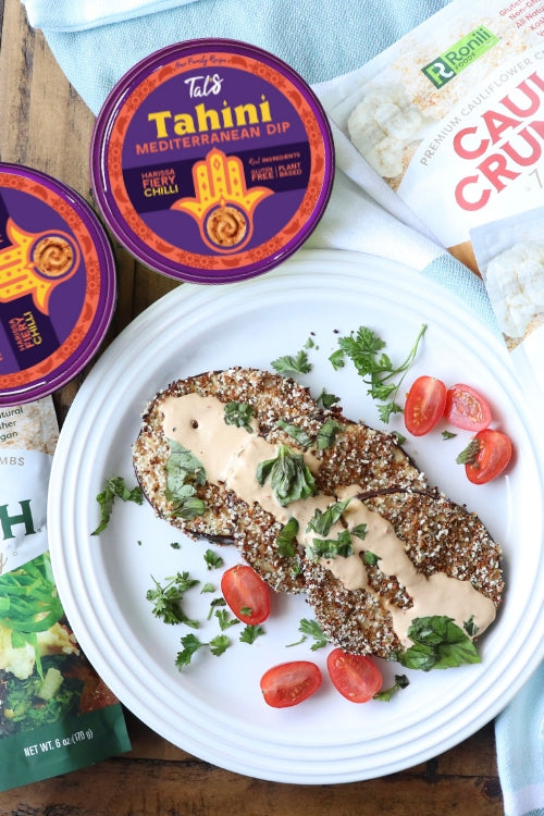 Spicy Cauli Crusted Eggplant on a plate with Tal's Tahini Mediterranean Dip Harissa Fiery Chilli featured.