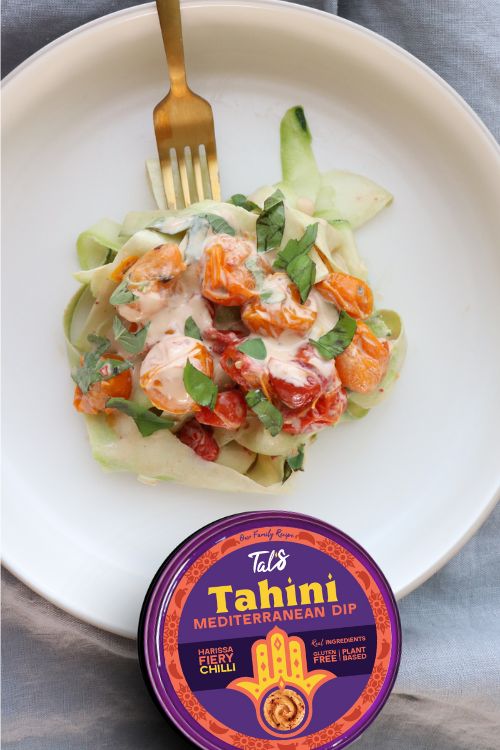 Spicy Keto Pasta on a plate with Tal's Tahini Mediterranean Dip in Harissa Fiery Chilli flavor displayed.