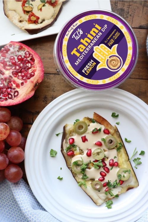 Easy Eggplant Steak on a plate, featuring Tal's Mediterranean Tahini Mediterranean Dip in the Fresh Lemon flavor
